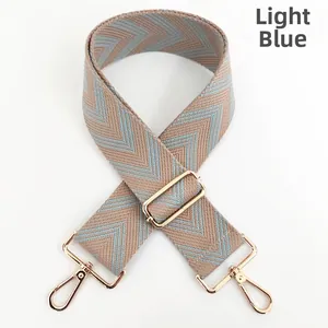 Adjustable light blue woven shoulder strap with gold metal hooks and chevron pattern