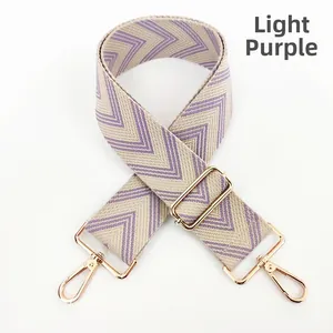 Adjustable light purple and beige woven shoulder strap with gold metal buckles