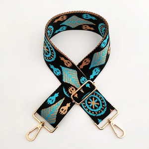 Bandoulière large brodée style ethnique avec motif bleu et doré sur sangle noire
