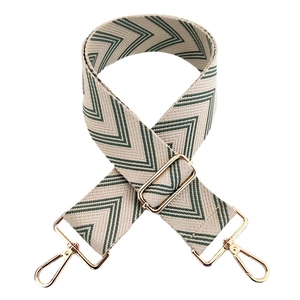 Adjustable woven canvas shoulder strap with green chevron pattern and gold hardware
