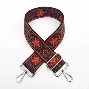 Detail of 5cm wide ethnic floral embroidery strap with silver metal swivel hooks