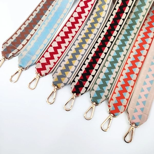 Ethnic wide woven shoulder straps with colorful wavy patterns and gold lobster hooks