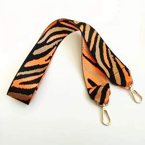 Adjustable wide replacement shoulder strap with orange and black tiger stripe pattern