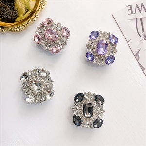 Detailed view of colorful square crystal rhinestone foldable cell phone socket grips