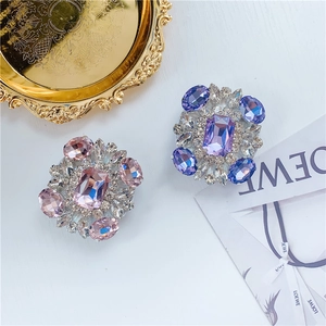 Close-up of sparkling crystal square diamond phone sockets in pink and purple colors