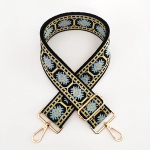 Ethnic jacquard woven bag strap with golden metal swivel hooks and adjustable buckle length