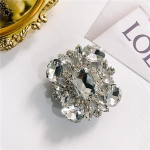 Detailed view of luxury crystal flower phone grip with radiant rhinestone diamond inlay