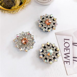 Close-up of luxury flower-shaped crystal phone sockets with sparkling rhinestones