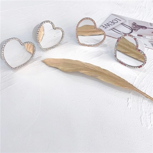 Glittering heart-shaped mirror phone grips with multicolored rhinestone borders