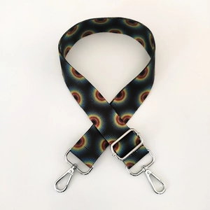Detail of colorful ethnic pattern shoulder strap with glossy silver swivel lobster clasps