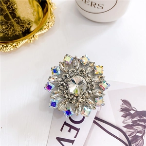 Close-up of luxury snowflake phone grip featuring sparkling rhinestones and AB crystals
