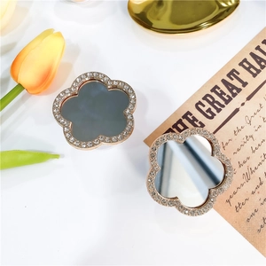 Elegant floral rhinestone mirror phone socket stand with minimalist tulip aesthetic