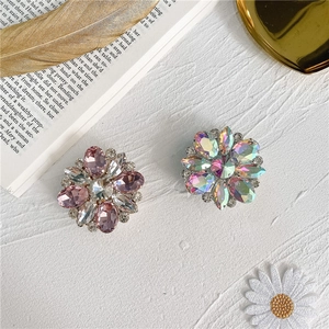 Close-up of sparkling floral crystal phone holders with diamond rhinestones on white background