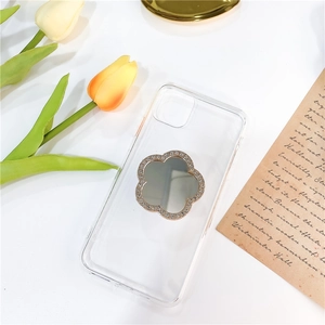 Close-up of diamond-studded flower phone grip on a clear transparent phone case