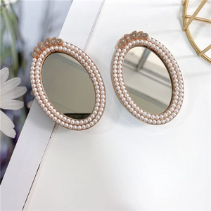 Detail of luxury oval phone grips with dense pearl borders and sparkling rhinestones
