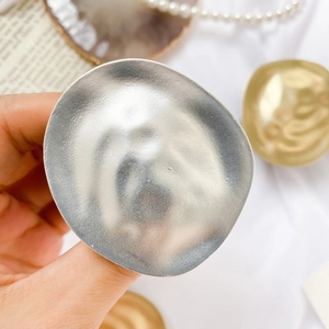 Minimalist irregular metallic phone grip in matte gold and silver finishes