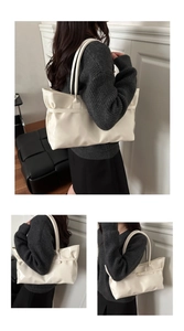 Detail of minimalist cream leather tote bag with glossy finish and long shoulder straps