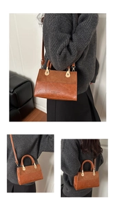 Detail showing brown leopard patchwork PU leather bag with woven handle and gold hardware