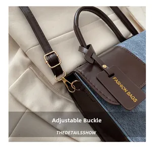 Close-up of adjustable gold-tone buckle and brown leather strap on fashion bag