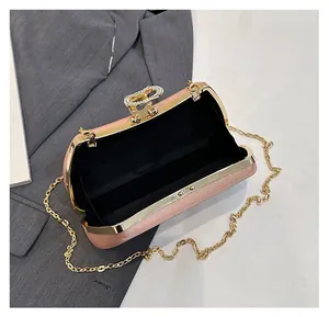 Interior view of pink sequin evening clutch featuring gold chain and metal clasp
