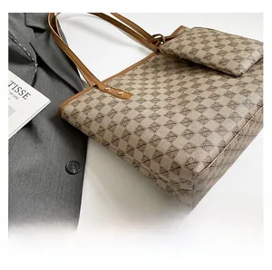 Detail shot of vintage pattern tote bag set with matching inner pouch and leather straps