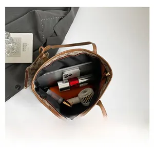 Detailed interior of large brown leather tote showing spacious capacity for daily essentials