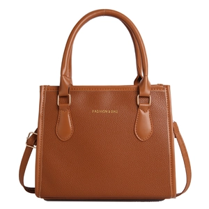 Brown textured leather handbag with gold Fashion and Bag logo and dual handles