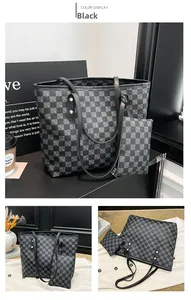 Detail view of the black checkered tote bag set with a matching small inner pouch