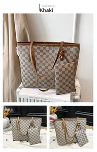 Detail view of khaki monogram tote bag set with matching zipper pouch and brown trim