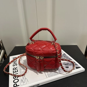 Chic red quilted leather vanity bag with gold chain strap and dual zipper closure