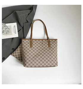 Flat lay of light brown tote bag set with matching pouch and geometric pattern print