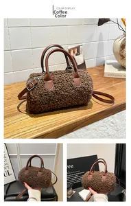 Close-up of coffee brown plush cylinder bag with leather handles and silver hardware