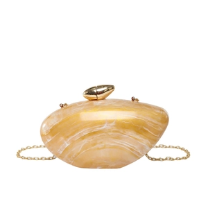 Minimalist acrylic handbag with amber marble texture and gold metallic clasp