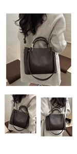Dunkelbraune Shopper-Tasche mit Lychee-Lederstruktur und goldenen Metallgriffen im Detail