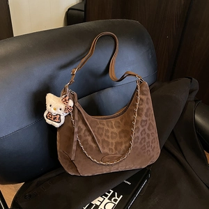 Retro leopard print crossbody bag with adjustable strap and decorative gold chain detail