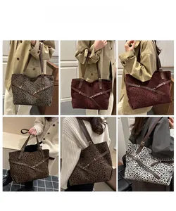 Collection of oversized leopard print tote bags in various colors with leather straps