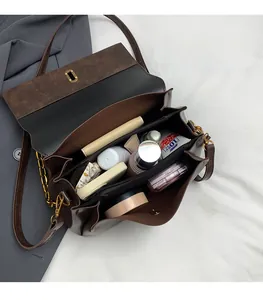 Internal view of retro crossbody bag showing spacious capacity for daily cosmetics
