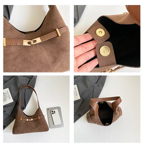 Detail of vintage brown suede tote bag with magnetic closure and golden hardware buckle