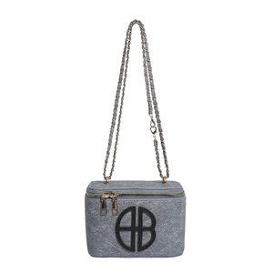 Chic grey felt square crossbody bag with a circular logo and golden chain strap
