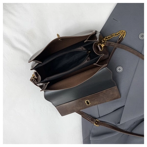 Interior view of vintage crossbody bag with multiple compartments and gold zipper pocket