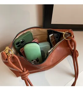 Detailed interior view of large caramel leather tote bag showing spacious storage capacity
