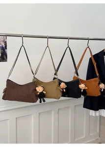 Suede shoulder bags in four colors with cute cat charms and pleated side detail