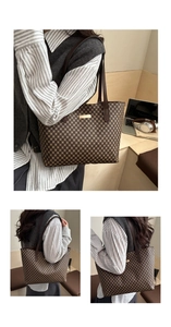 Detail view of large tote bag with vintage check pattern and gold metal hardware