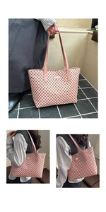Detail of pink tote bag with geometric chain print and gold metal plate ornament