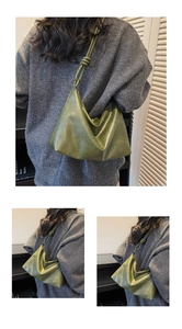 Macro view of dark green hobo bag with unique knotted shoulder strap and soft leather texture