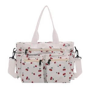White cherry print tote bag with multiple pockets and adjustable shoulder strap