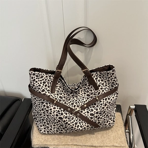 Classic leopard print tote bag with brown leather straps and gold buckles for women
