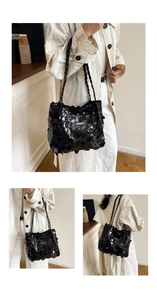 Detail of black sequined tote bag with woven shoulder straps and shiny texture