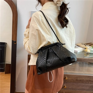 Chic black woven crossbody dumpling bag with detailed leather texture and slim strap