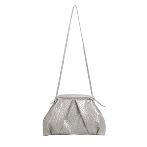 Minimalist silver shell bag with woven texture and adjustable shoulder strap for women